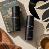 Face + Beard Essentials Kit — Cleanse and Hydrate flat lay with vintage mountain book, record, and morning coffee