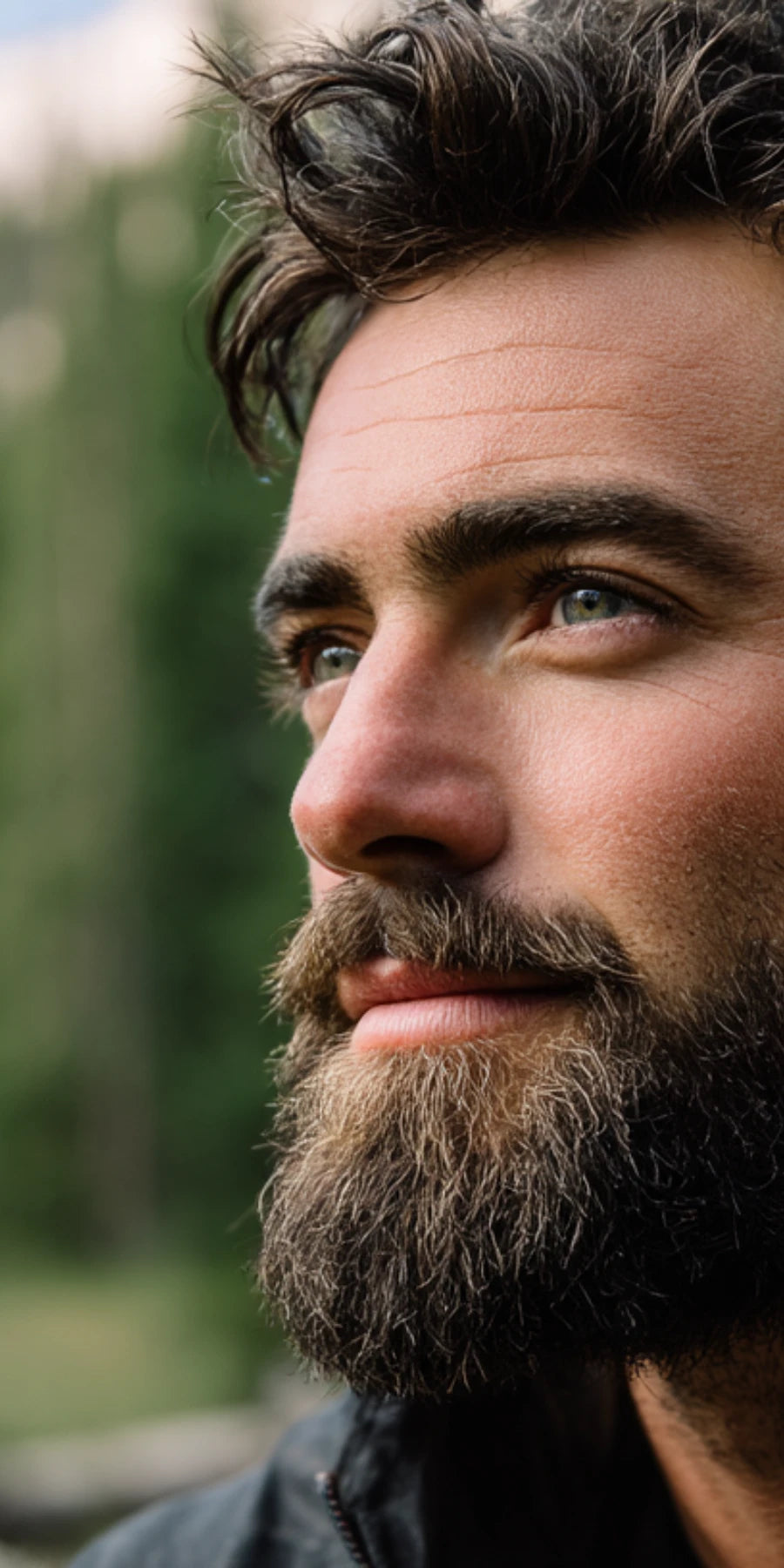 Close-up of bearded man with healthy skin, highlighting Stubble & Stache beard care and men’s skincare products.